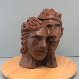 Enmashed couple. Made of Terracotta.11.5 H by 28  inch perimeter