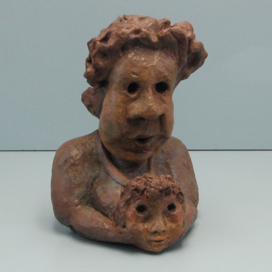 Anxious about her grandson.Made of clay. 9 H by 19.5 inch perimeter