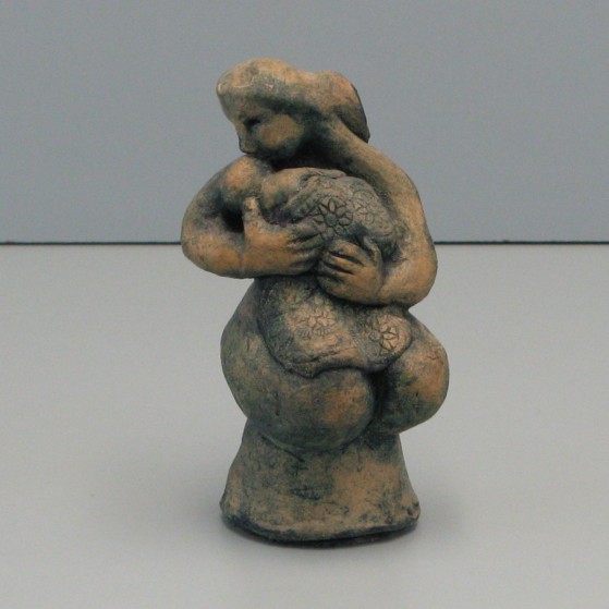 Motherhood .Made of clay.6 H by 8 inch perimeter.