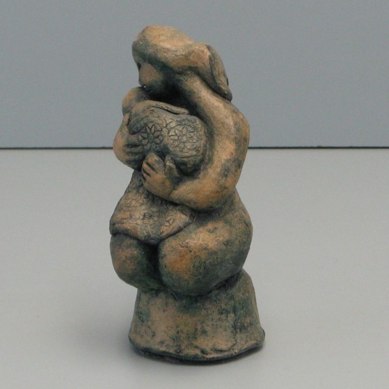 Motherhood.Made of clay.6 H by 8 inch perimeter.