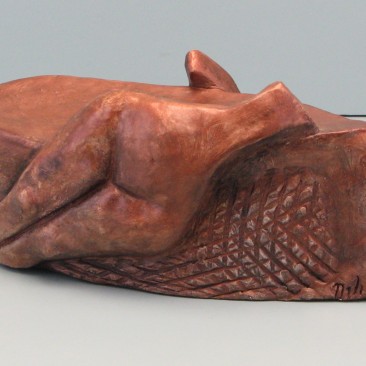 2 sided female .Made of  Terracotta. 3.5 H by 9.5 L by 3.5 inch W 